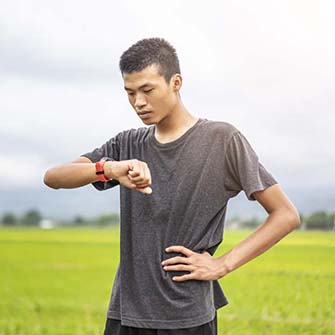 young man checking his heart rate